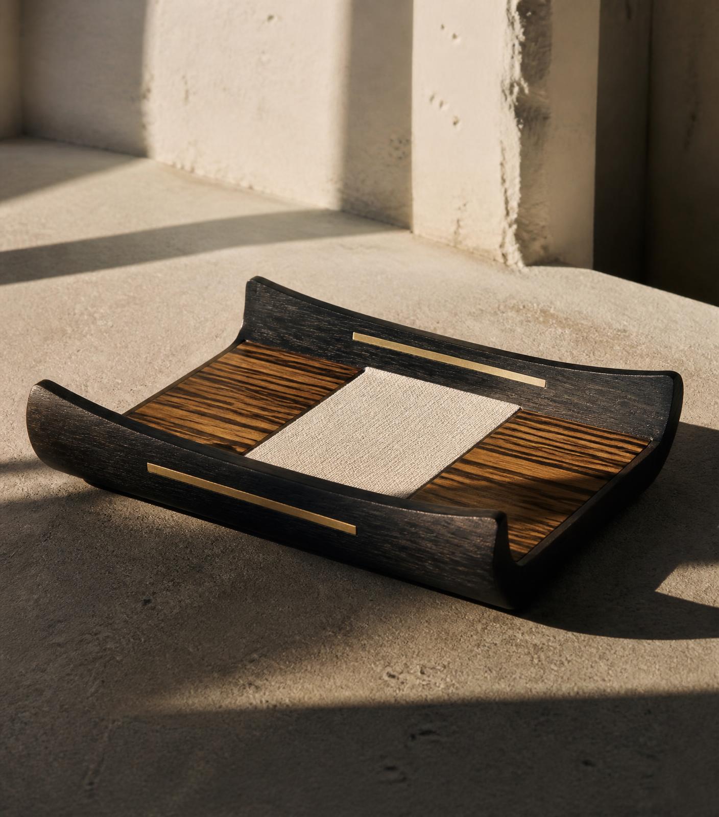 Ebony and zebrawood valet tray with brass inlay and canvas panel